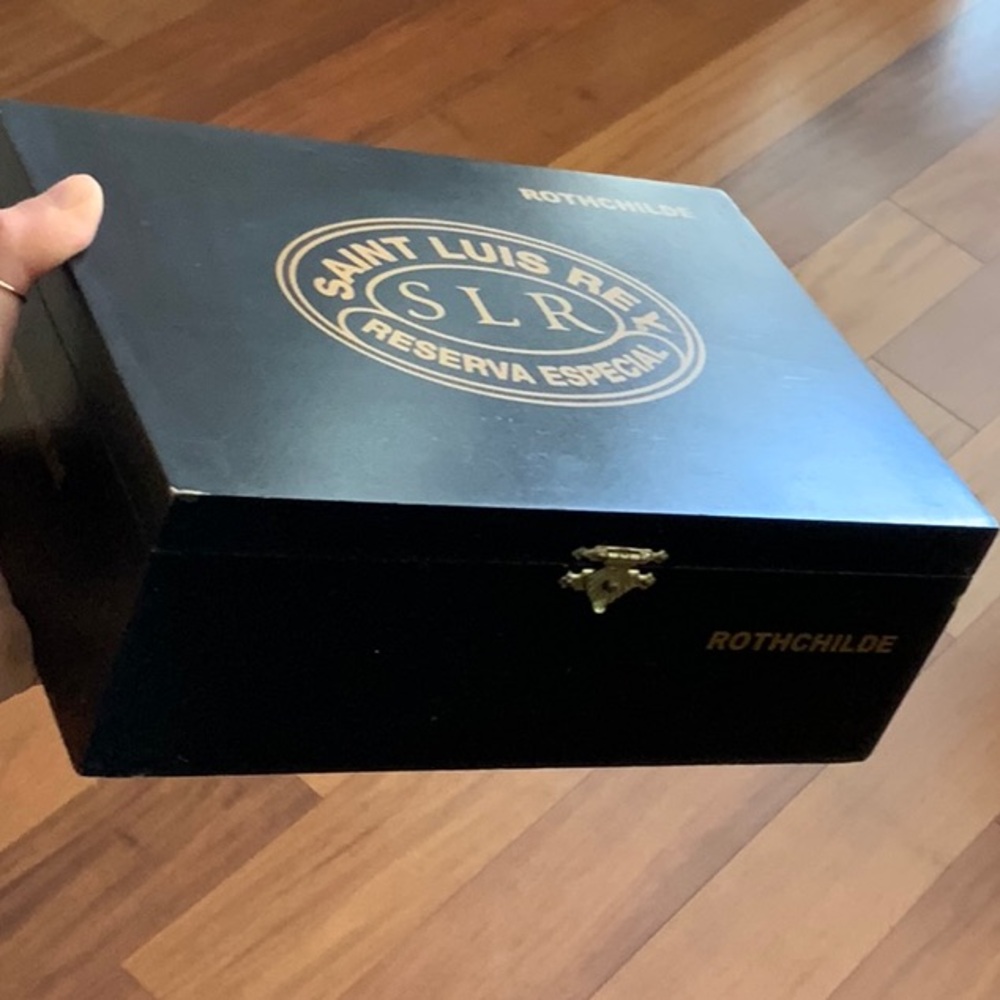 empty black Rothchilde Saint Luis Rey cigar box made of wood with snap closure